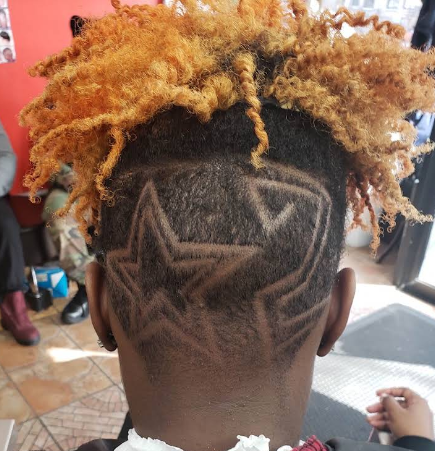 Star hair design with blonde curly top styling
