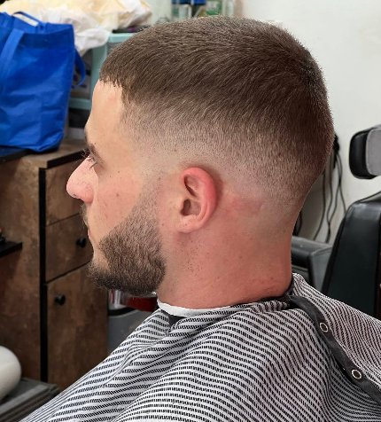Low taper fade with clean neckline on a client at Classic Kuts