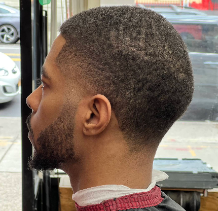 Mid fade with beard blend and crisp line-up